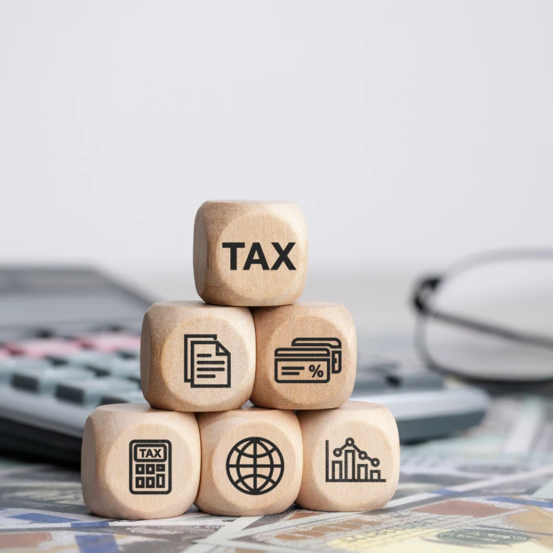 a group of blocks shaped into a pyramid with the top most saying TAX